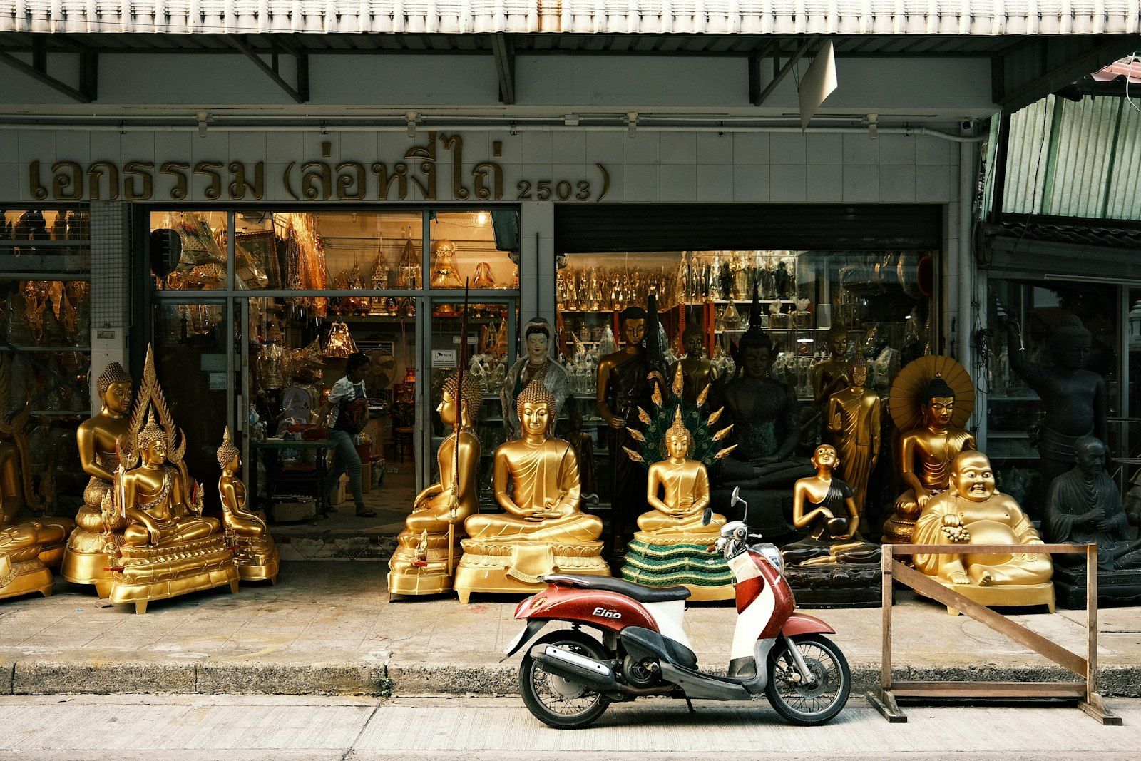 A scooter parked on a Phuket street, the kind of rental bike to photograph before you ride