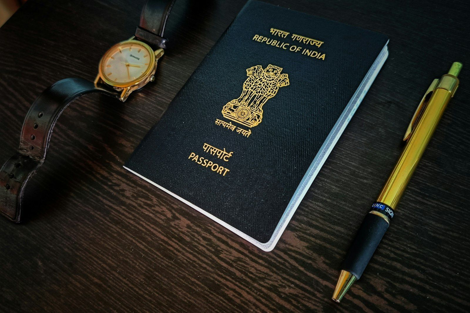 Passport and pen on a desk, the core documents needed for a Thai bank account for foreigners