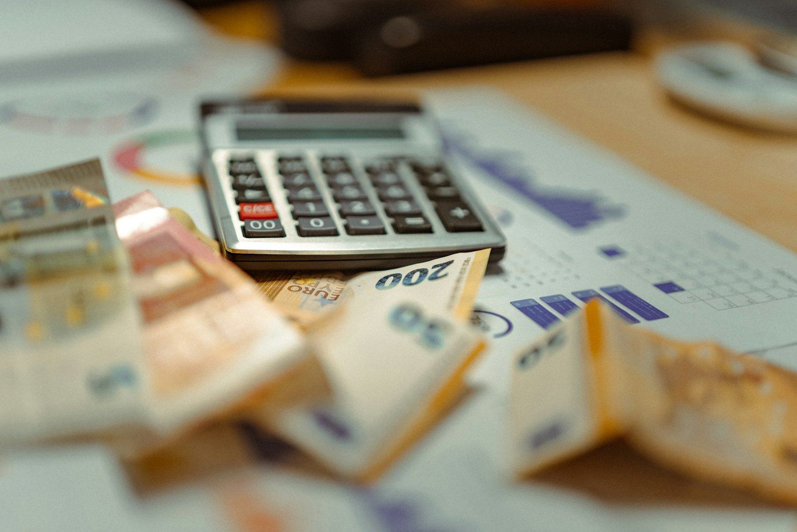 Calculator and Thai baht illustrating Thailand income tax rates for foreigners in 2026