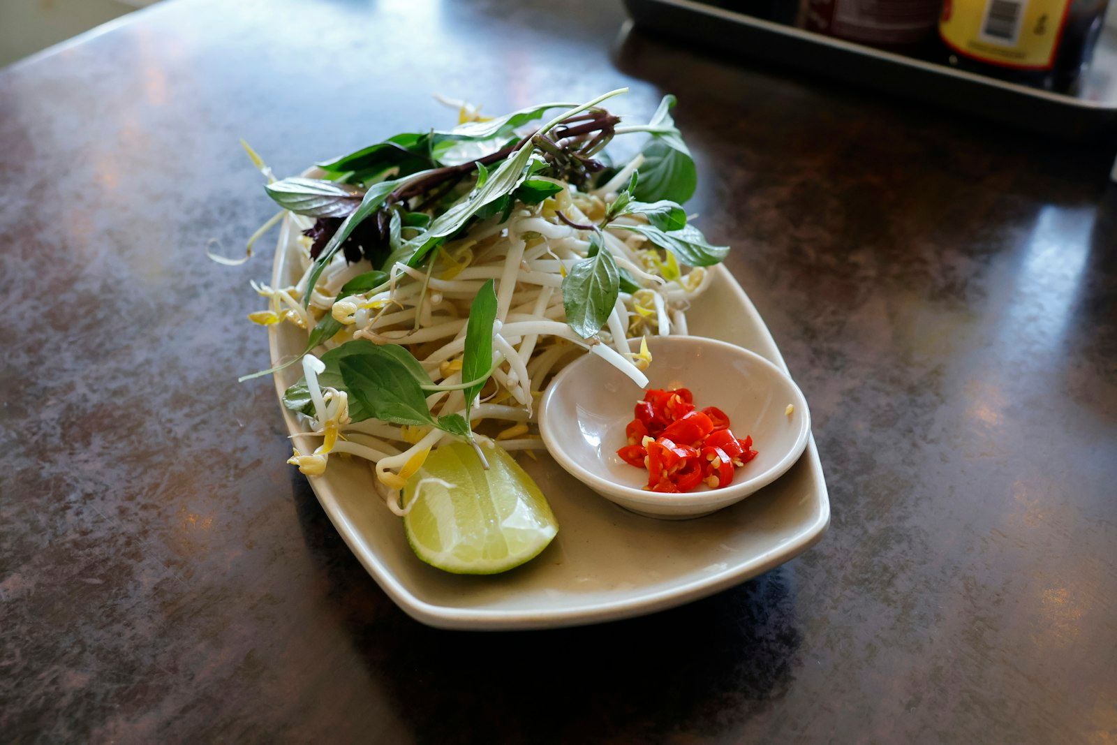 Fresh Thai herbs, lime, bean sprouts and chilies, the low-calorie backbone of healthy Thai food