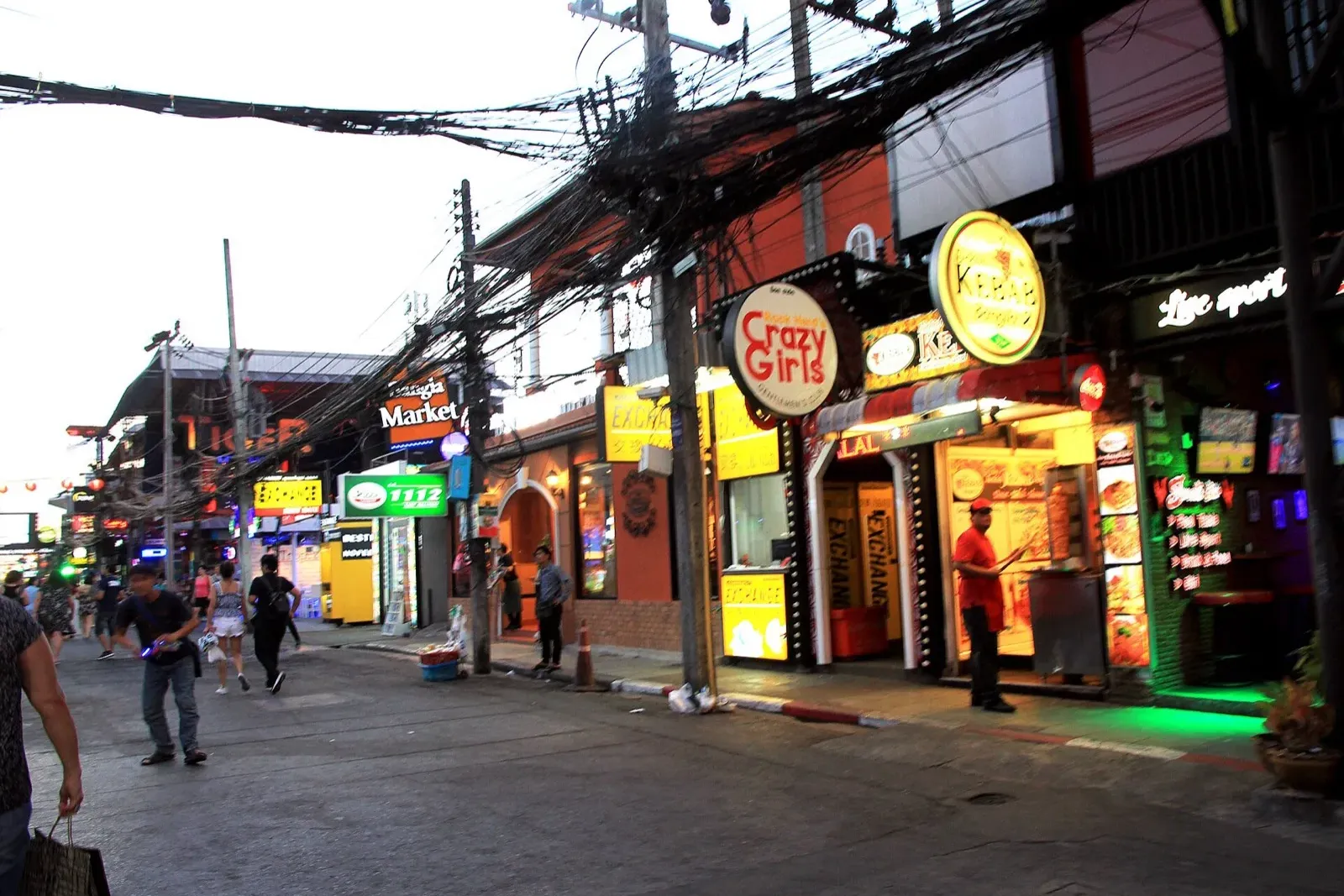 Crowded Bangla Road nightlife in Patong where bar-bill padding scams occur