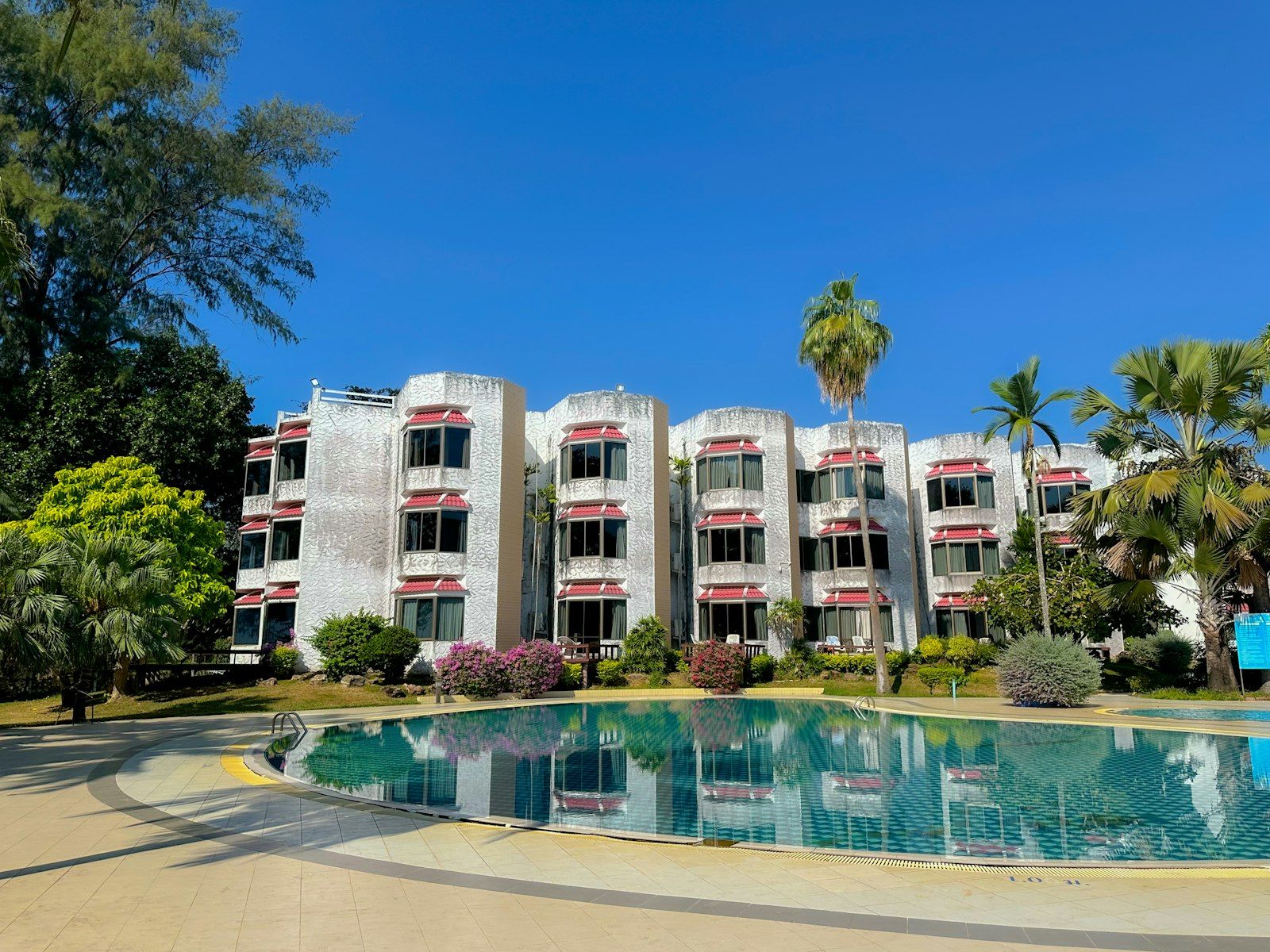 A tropical condominium with a swimming pool, typical of expat housing in Phuket