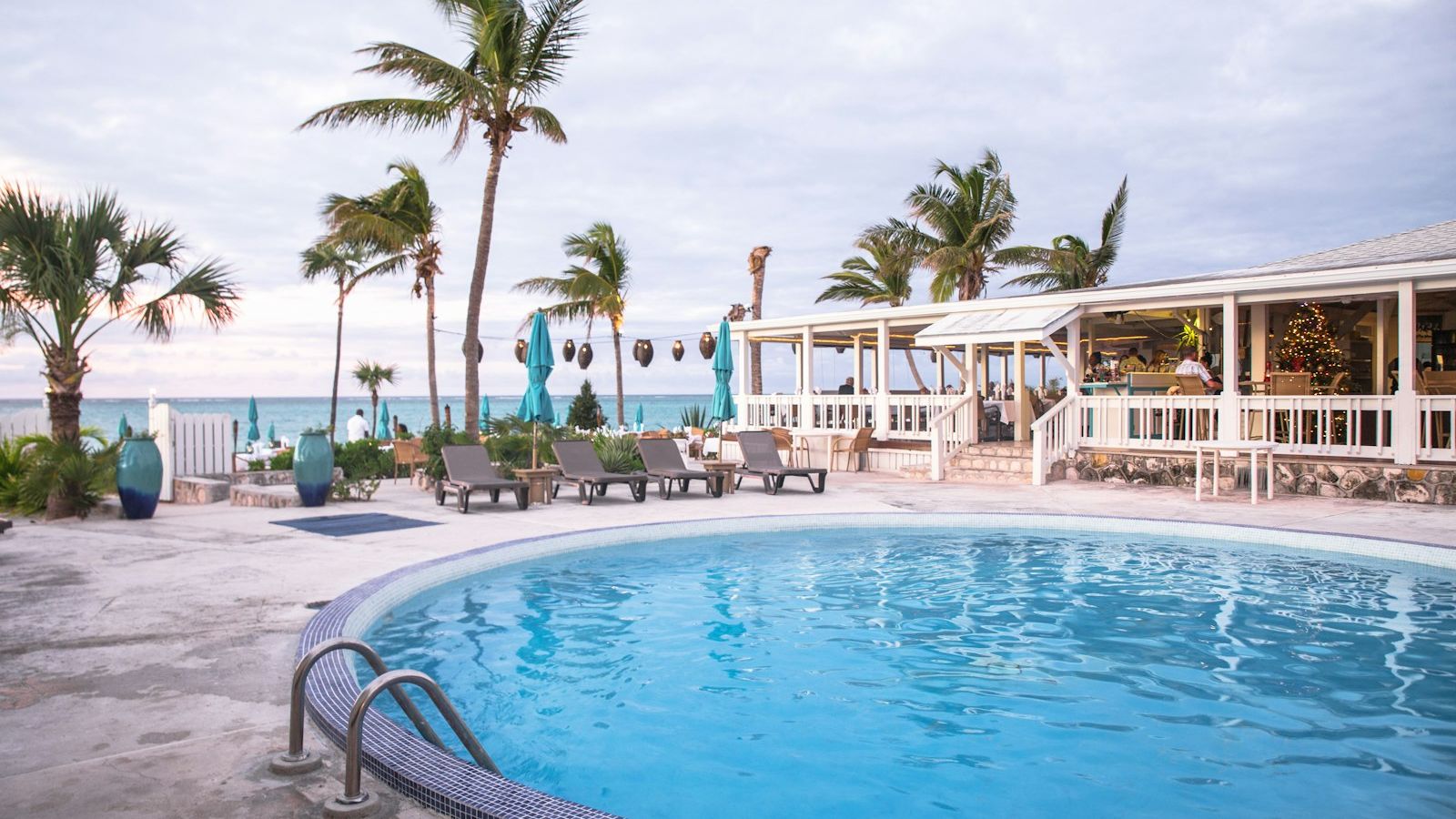 Lively beach club swimming pool in Patong Phuket during daytime