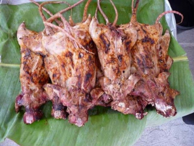 Grilled field rats on a banana leaf, a rural Thai delicacy