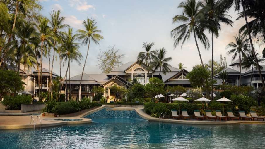 Beachfront pool and loungers at a Bang Tao resort day pass in Phuket