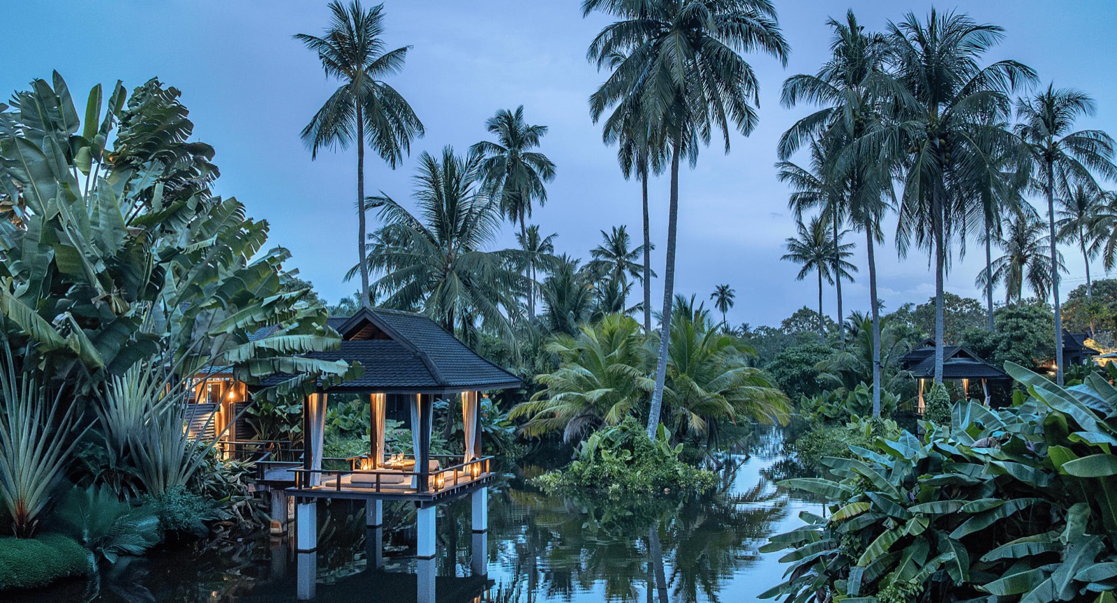 Central lagoon with a Thai sala pavilion at Anantara Mai Khao Phuket Villas