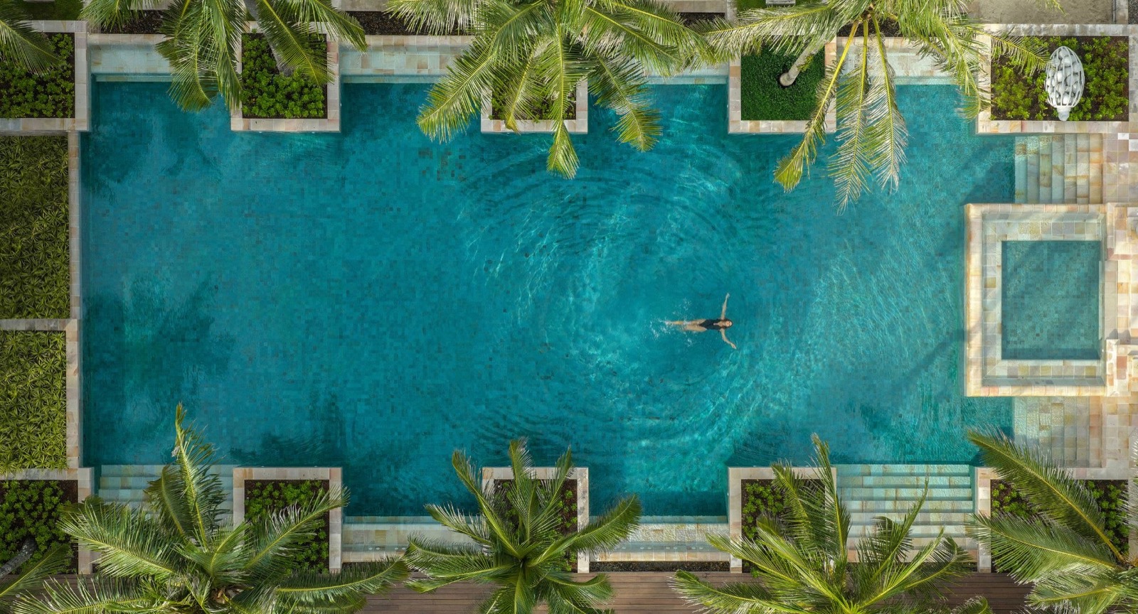 Aerial view of the main pool at Anantara Mai Khao Phuket Villas