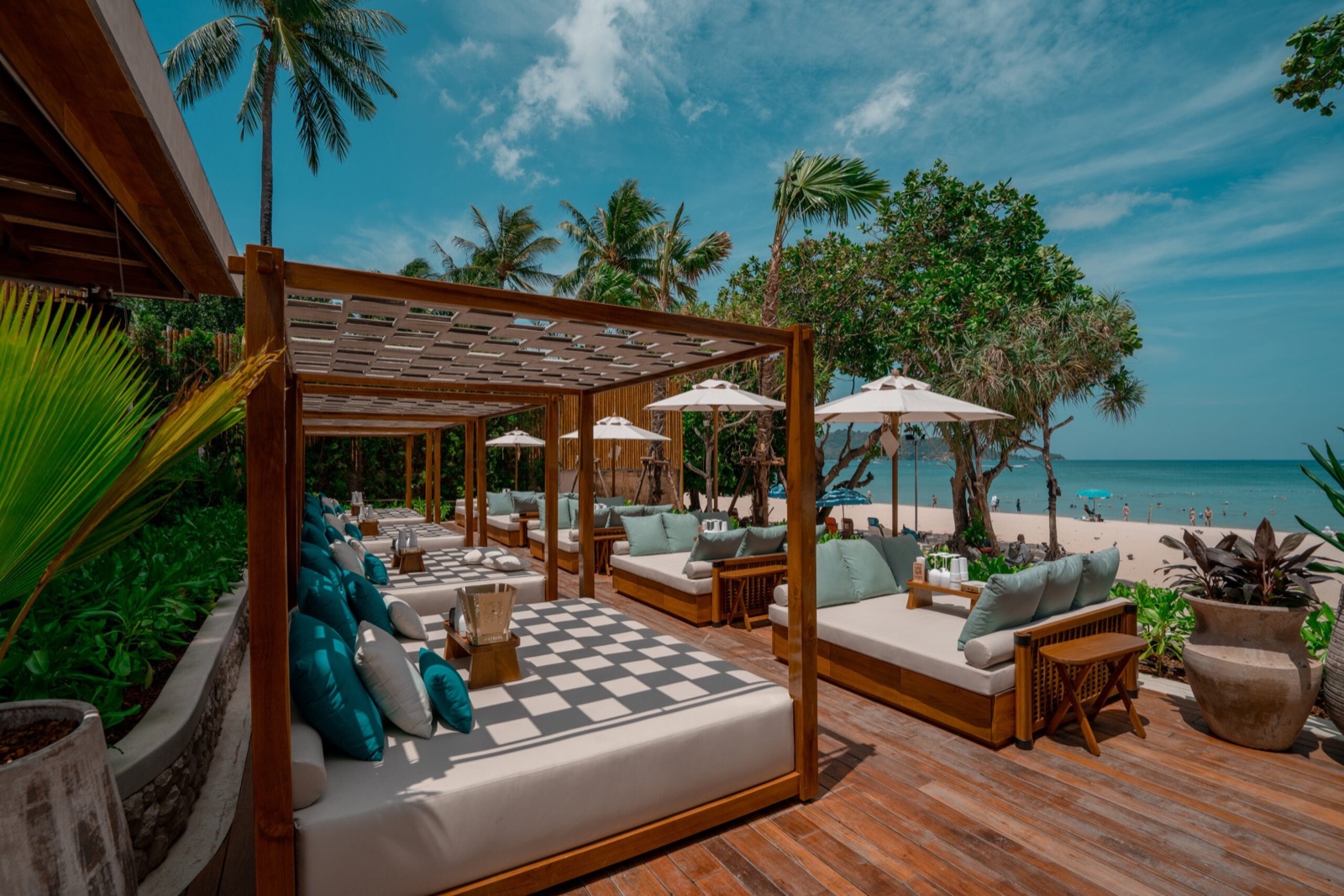 Shaded beachfront cabana beds at Barra Cuda Beach Club, Patong