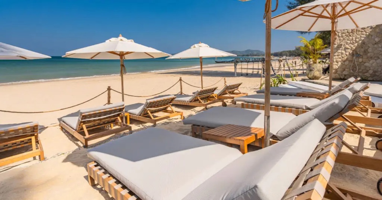 Beach sunbeds on the sand at Catch Beach Club, Bang Tao, Phuket