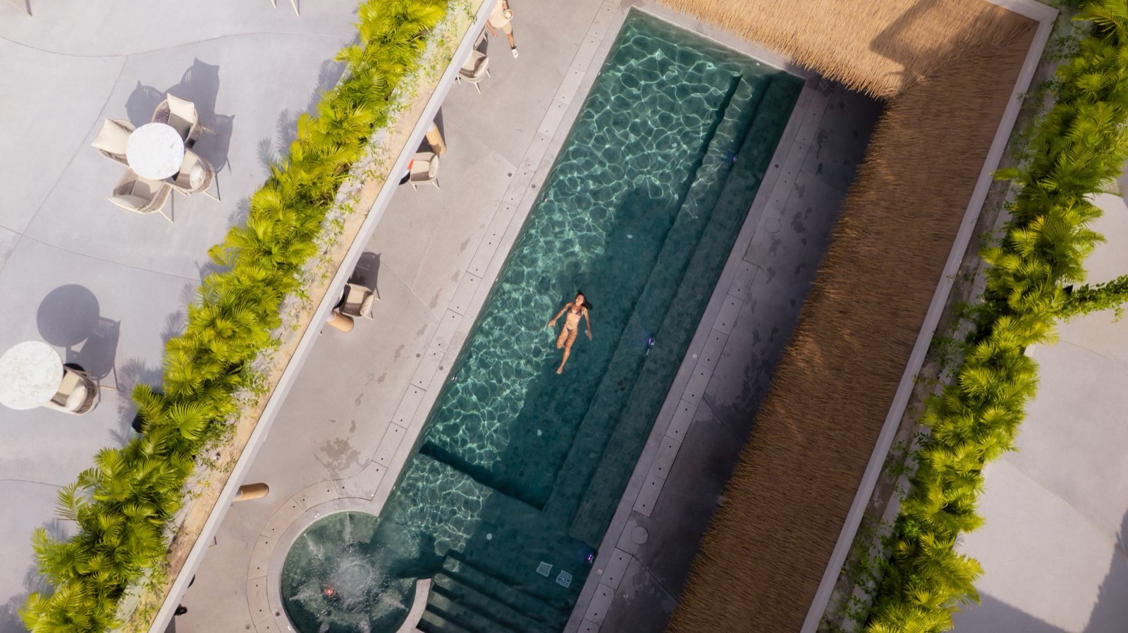 Aerial view of the main pool at DOPA Sauna and Wellness Club, Bang Tao, Phuket