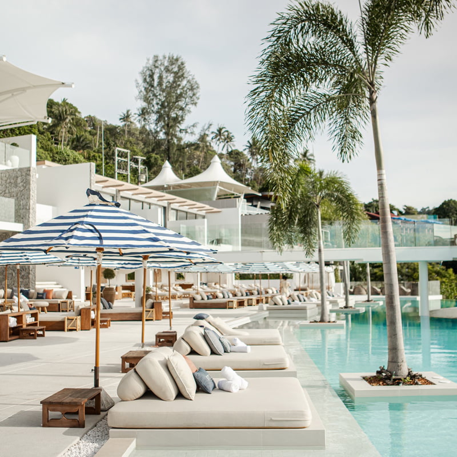 Swimming pool and sun beds at Fira Beach Club day pass in Karon, Phuket