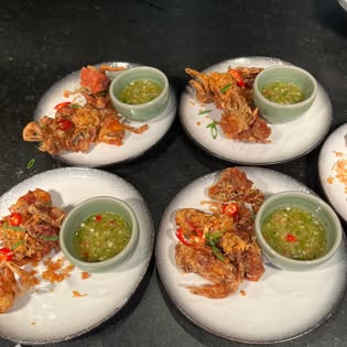 Plates of crispy fried soft-shell crab with green seafood dipping sauce at Khrua Ohm, Southern Thai restaurant in Chalong, Phuket