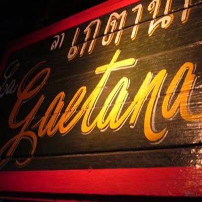 Hand-painted wooden signboard with gold cursive lettering for La Gaetana Italian restaurant in Old Town, Phuket