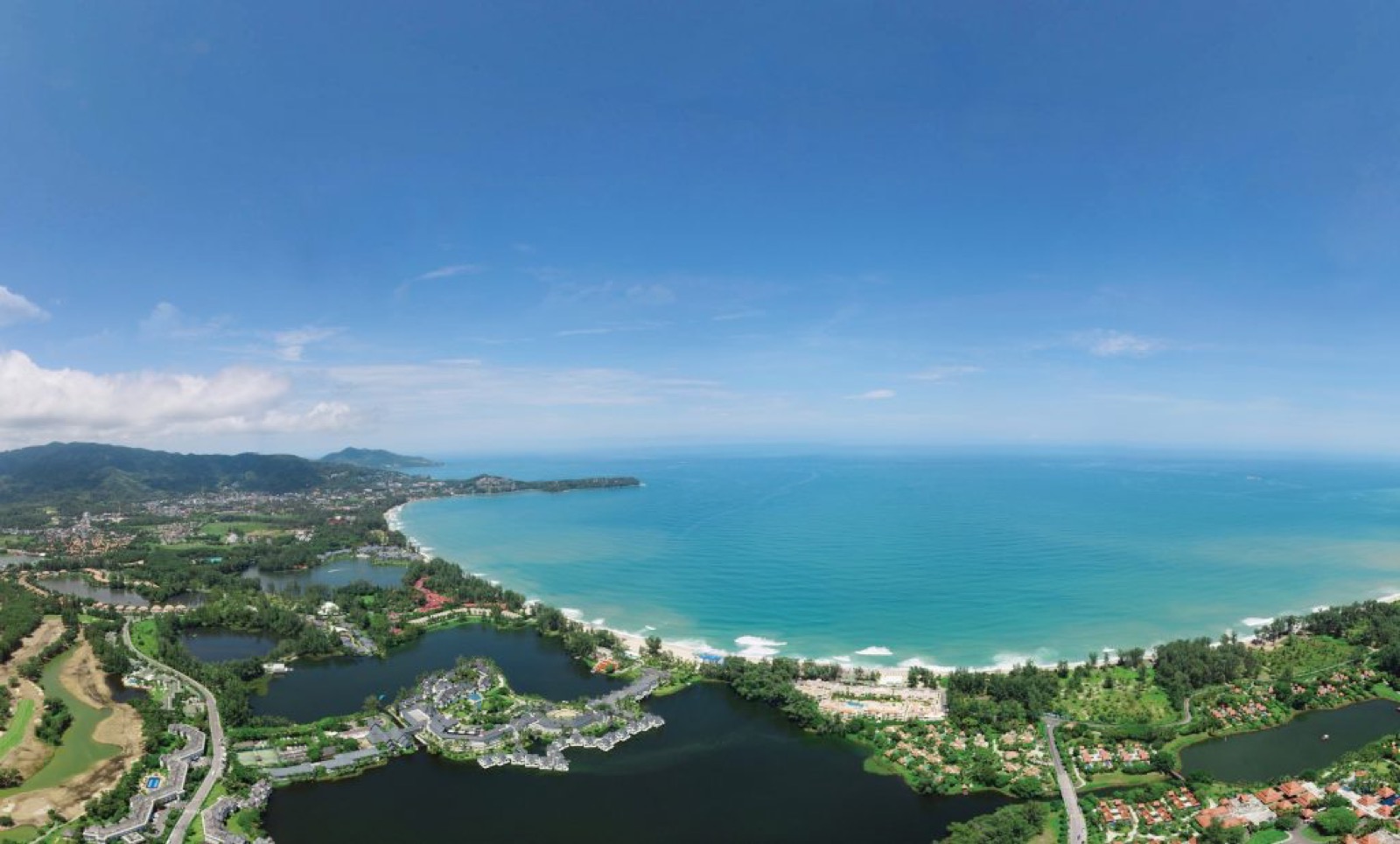 Aerial view of Laguna Phuket integrated resort complex and lagoons on Bang Tao Beach