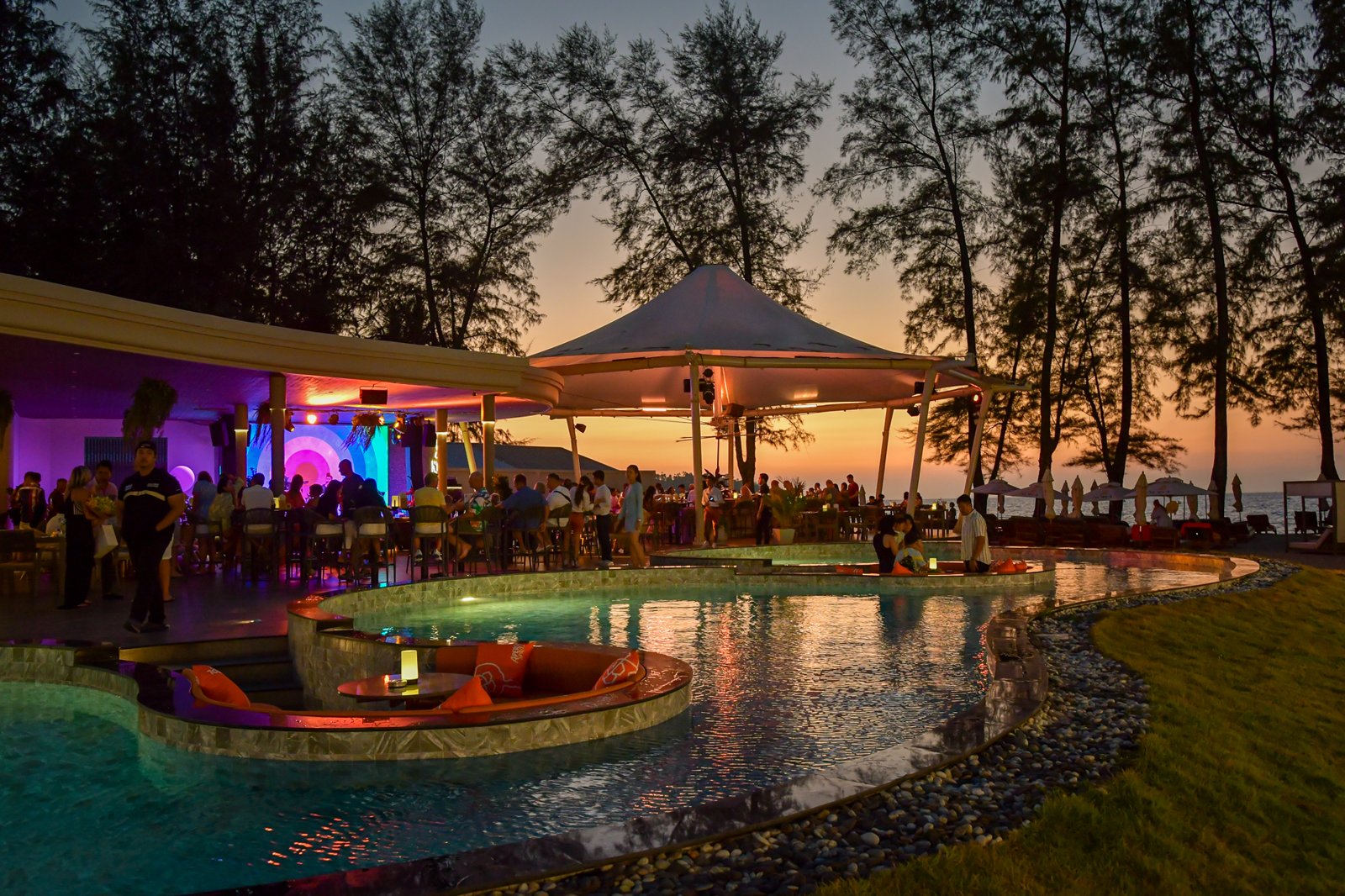 Sunset pool lounge at NORA Beach Club, Bang Tao Beach, Phuket