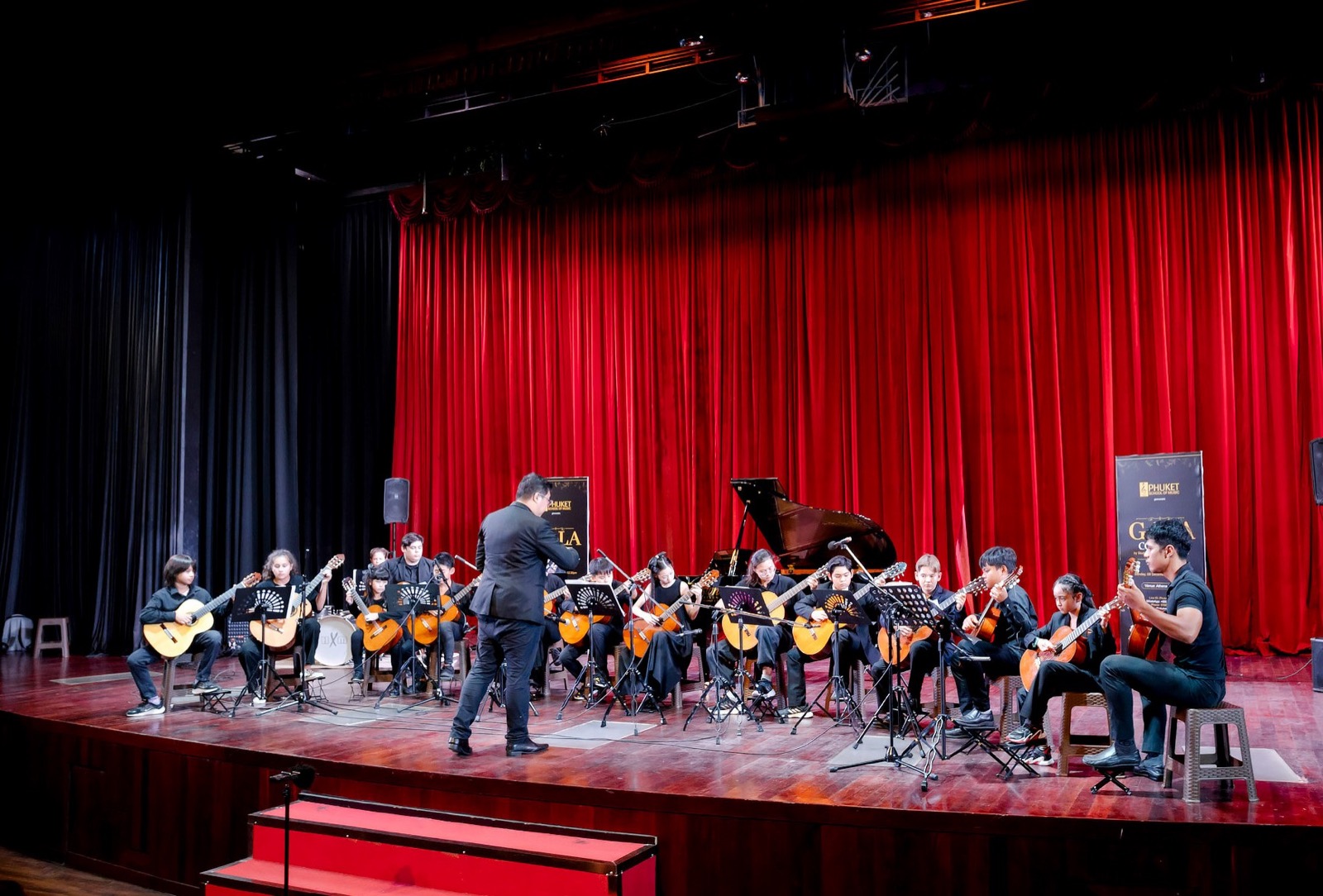 Phuket School of Music student ensemble performing a concert on stage