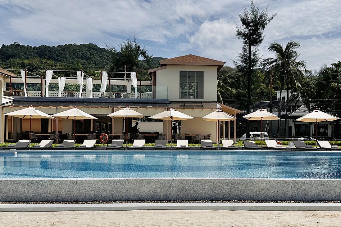 Poolside umbrellas and loungers at The Shore Beach Club, Kata Noi, Phuket